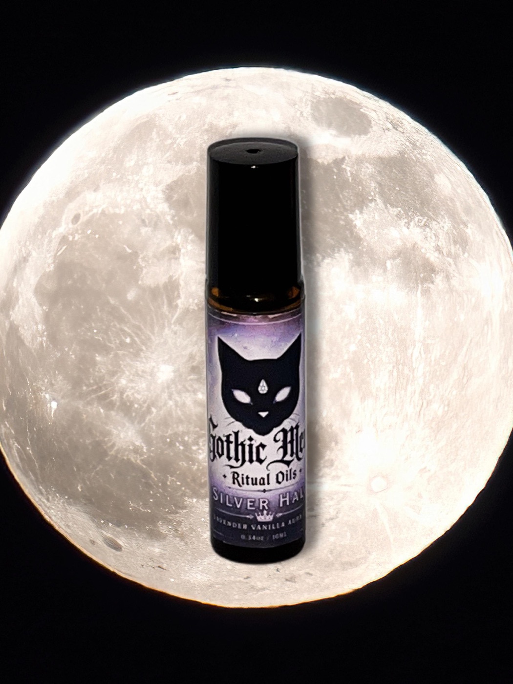 Silver Halo bottle set against a bright full moon